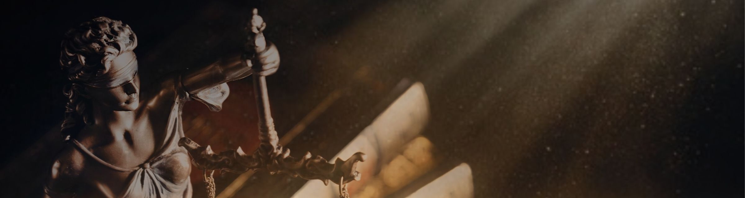 Scales of Justice figure with light